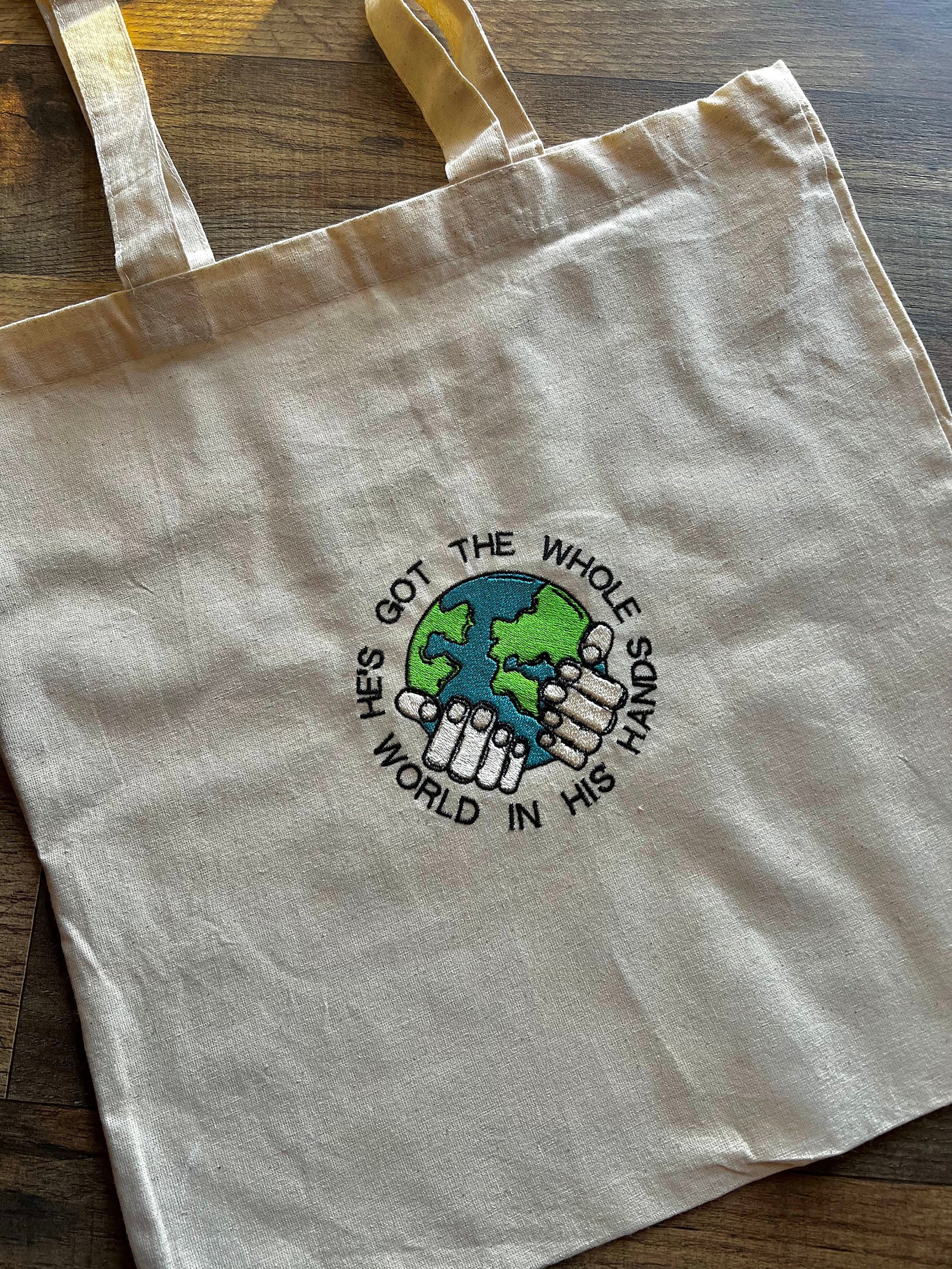 “He’s Got the Whole World in His Hands” Tote Bag