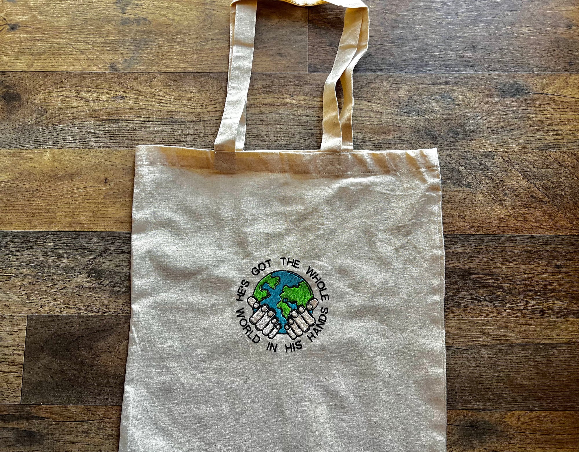 “He’s Got the Whole World in His Hands” Tote Bag
